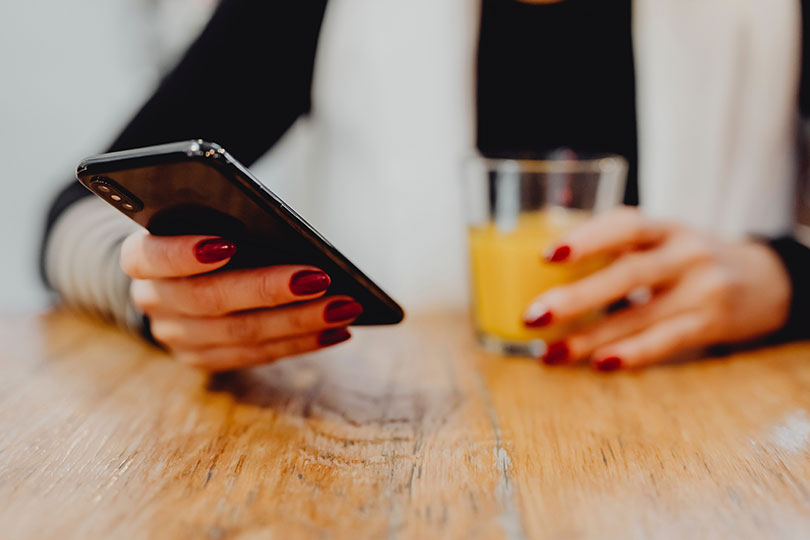 Woman checks her mobile phone.