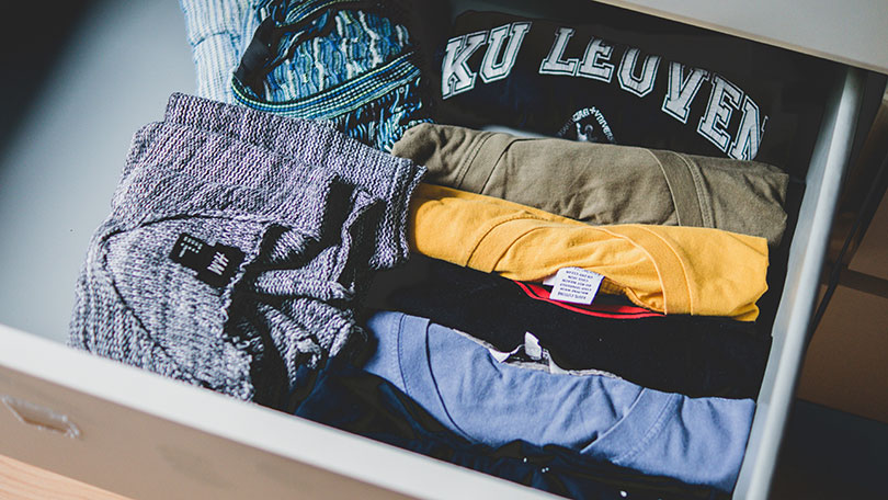 Drawer of folded shirts