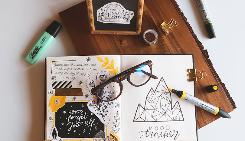 Creative bullet journal with hand lettering and illustrations.