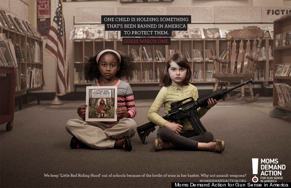 Child holding book and another child holding gun.