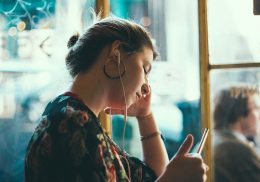 Woman listening to a podcast