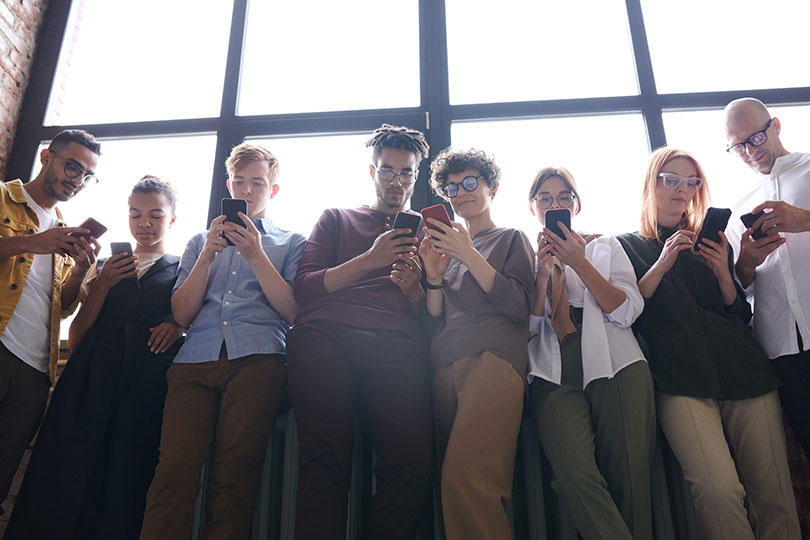 People looking at smartphones