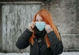 Woman wearing surgical mask.