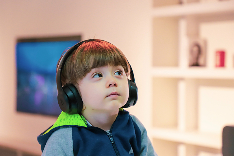 Little boy wearing headphones