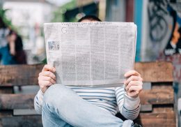 Man reading a newspaper.