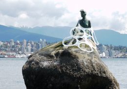 Plastic six-pack rings caught on mermaid statue