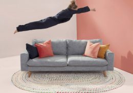 Woman diving onto a couch
