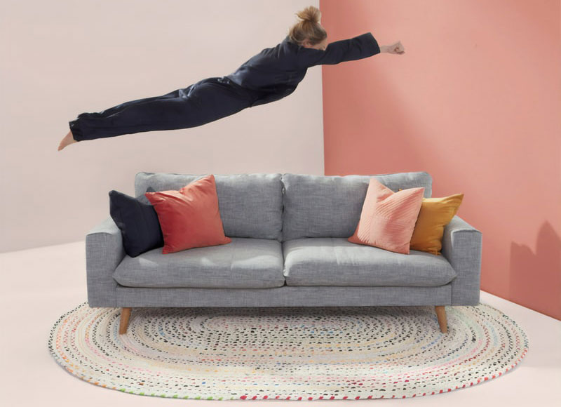 Woman diving onto a couch